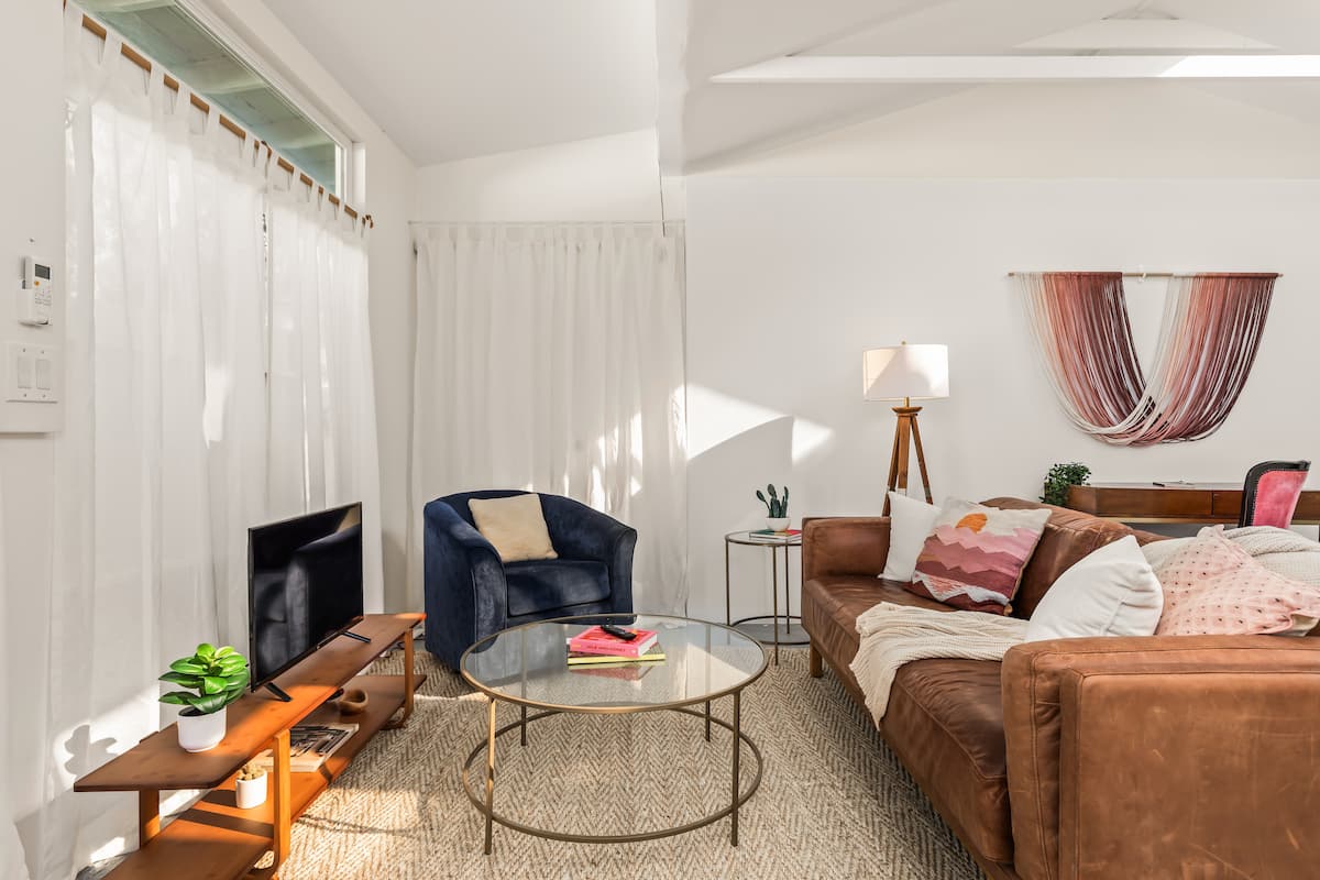 Bright living room with leather sofa, Venice Canals home